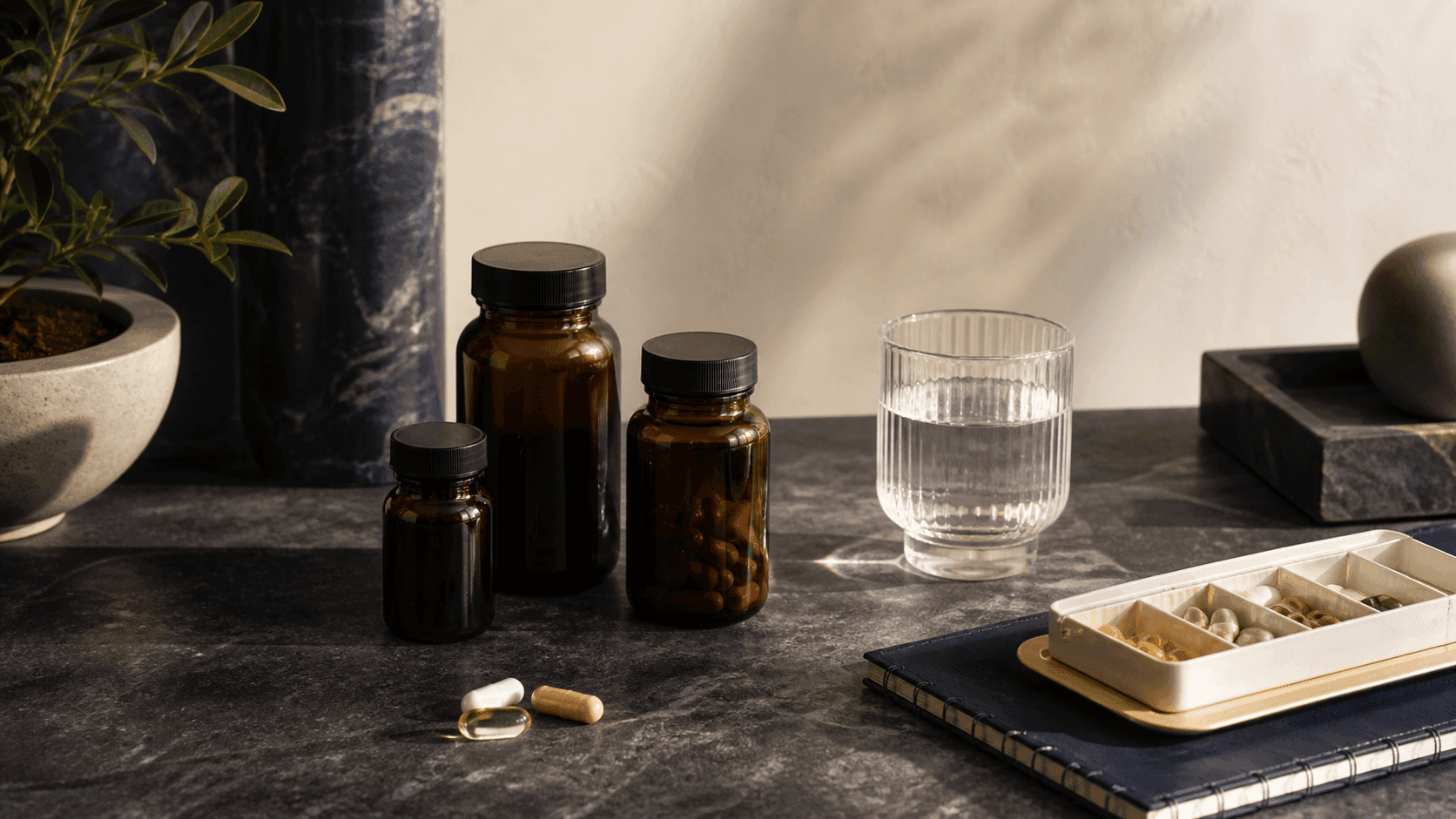 A curated supplement routine arranged beside a glass of water.